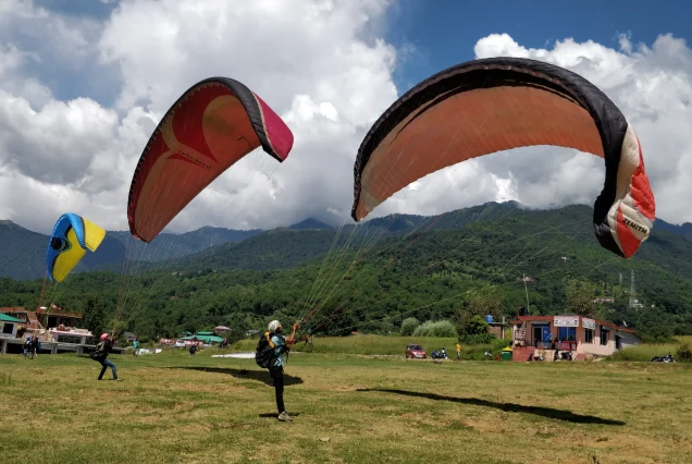 Paragliders at Bir Billing, Asia's second highest site, captured for a customized trip planner