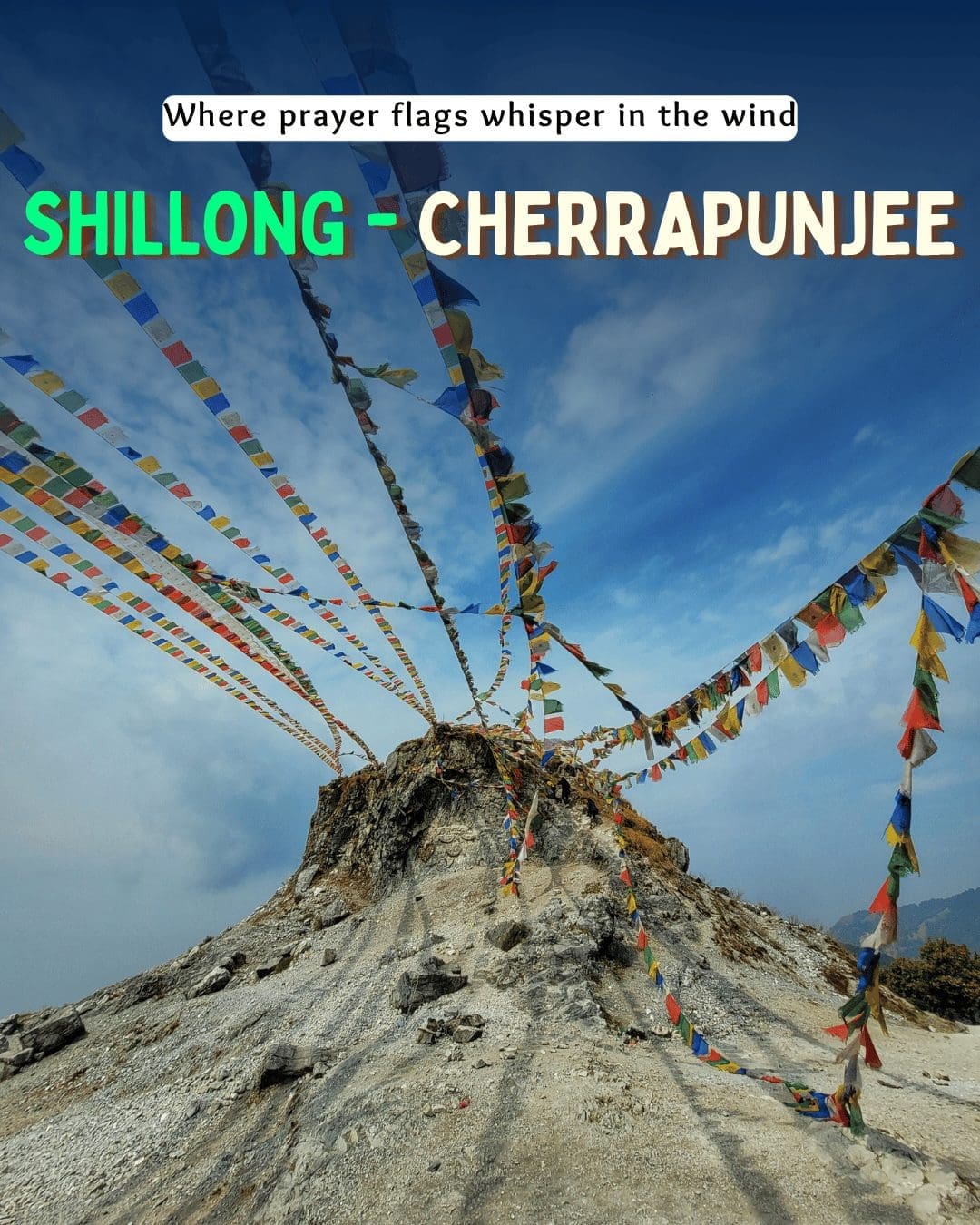 Colorful prayer flags tied on a rocky hilltop near Shillong and Cherrapunjee, close to Mawsynram village.
