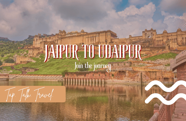 View of Amer Fort near water in Jaipur, symbolizing the Jaipur to Udaipur travel route